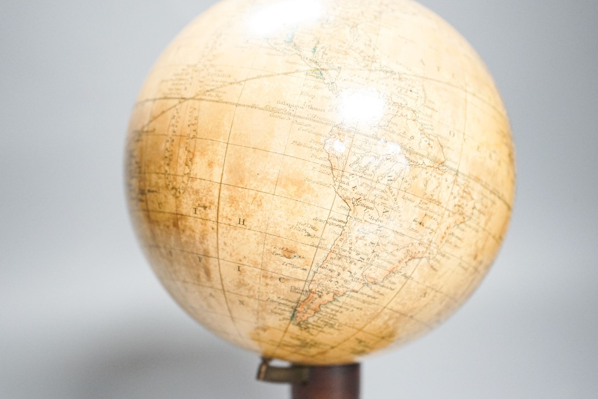 A Victorian Smith’s 5.5in. terrestrial globe, turned mahogany stand, 24cm